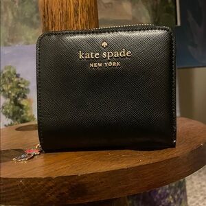 kate spade Black Saffiano Zip Around Wallet with Gold Logo